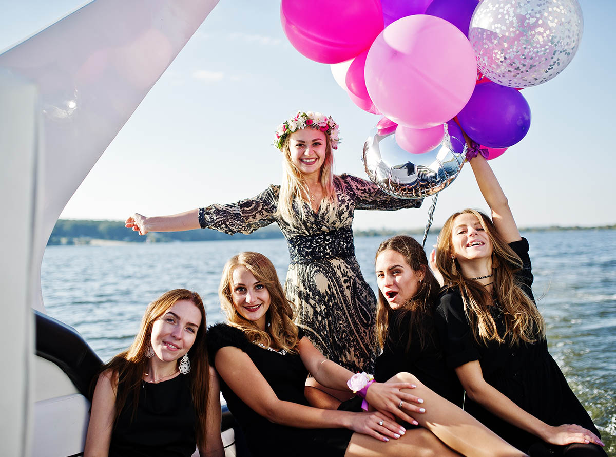 Group of man and woman friends enjoy outdoor party eating fresh